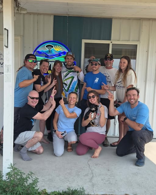 The Skydive Missoula crew and students gathered on the dropzone porch, cheering after a graduation